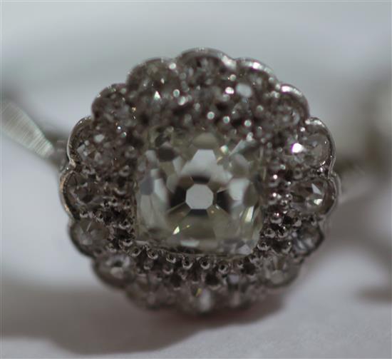 Two 1920s/1930s diamond cluster rings, sizes L & J respectively.